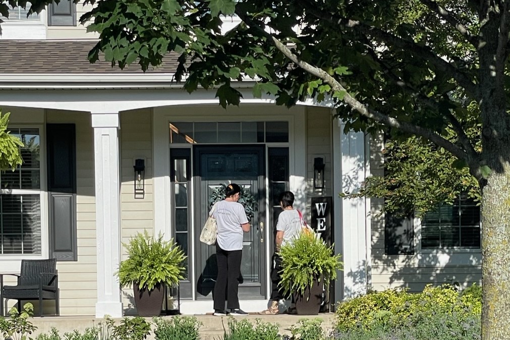 Great Touch Cleaning, Inc. cleaning crew entering customer's house